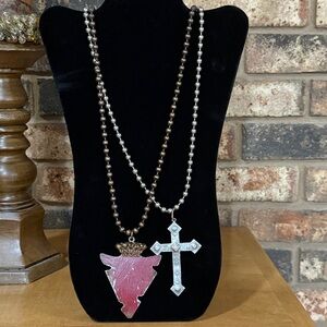 Southwestern arrowhead and cross pendant ball chain necklaces.
